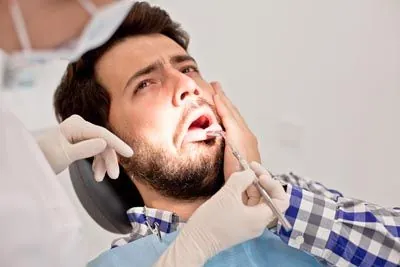 man visiting AZ Dental due to tooth pain