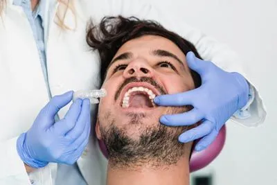 man getting fitted for an orthodontic aligner at AZ Dental