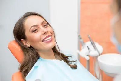 woman smiling in the dental chair before her restorative dentistry treatment at AZ Dental