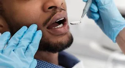 man receiving cosmetic dentistry care at AZ Dental