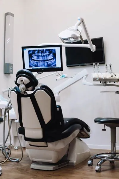 dental exam chair and dental tools found at AZ Dental