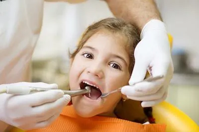 young girl getting her teeth cleaned at AZ Dental