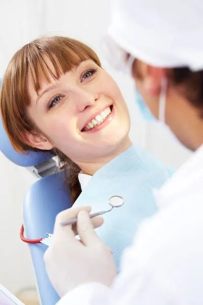 woman smiling before her oral surgery procedure at AZ Dental