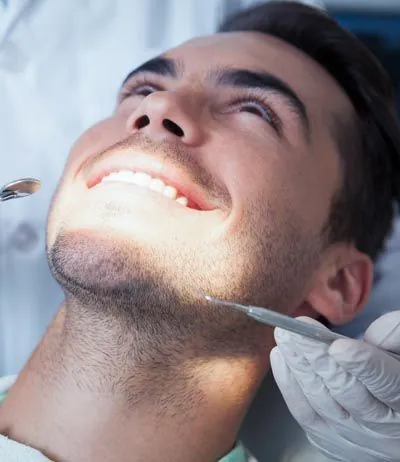 man sitting back in the dental chair at AZ Dental about to get his teeth checked